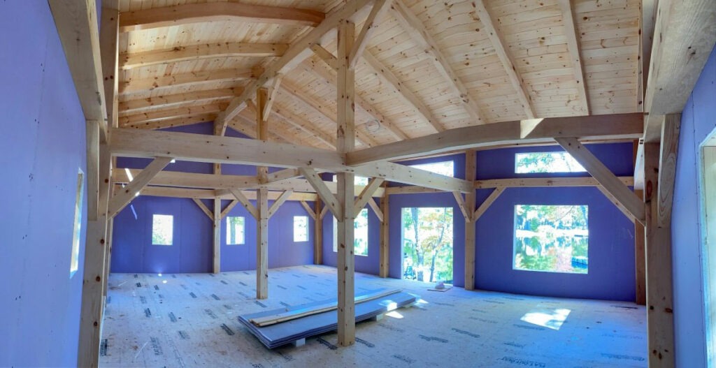 An interior of a timber frame home under construction